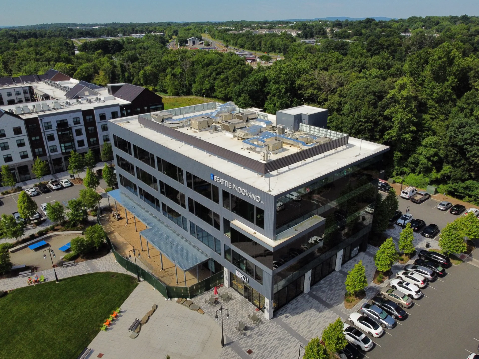Aerial view of a commercial building and its rooftop systems
